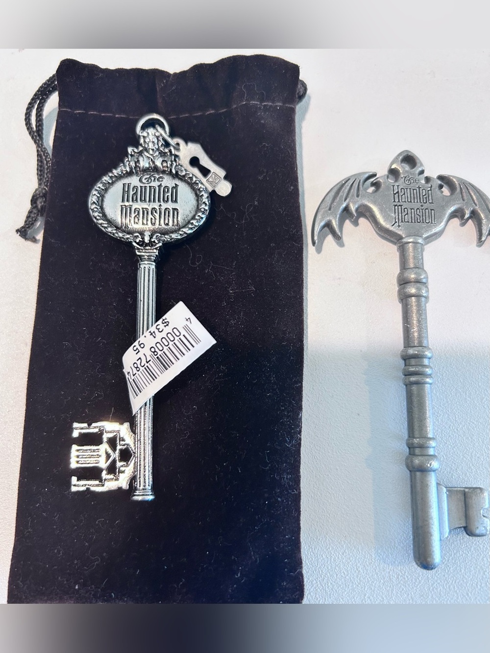 NWT X 1- SET OF TWO DISNEY HAUNTED MANSION COLLECTIBLE KEYS/KEY CHAIN